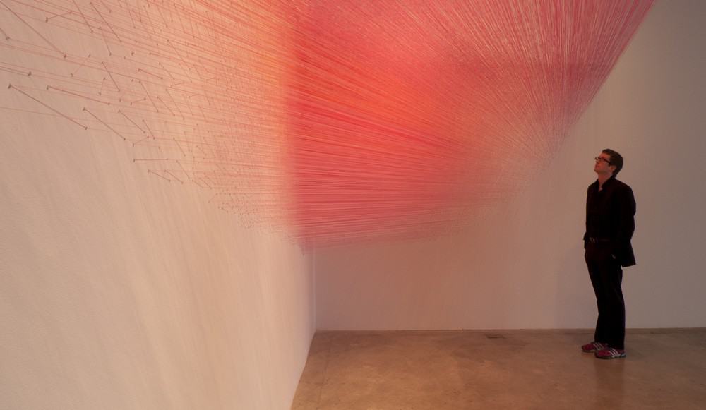 drawn pink (2013), cotton thread and staples, 335 by 6 by 16 feet