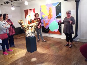 Jodi Colella explains some of the finer points of her sculptures at the pop-up called "Whack!"