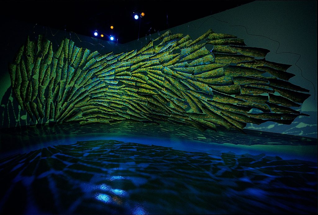 Island Blue (2000), salmon fish skins, fishing line,pigment, wire,, 7 feet 6 inches by 24 feet ( nstalled in the Decker Gallery, Maryland Institute College of Art).