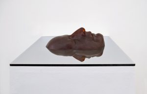Reflection of the Self III (2011), polyurethane, rubber, and two-way mirror, 48 h by 12 w by 12 inches deep