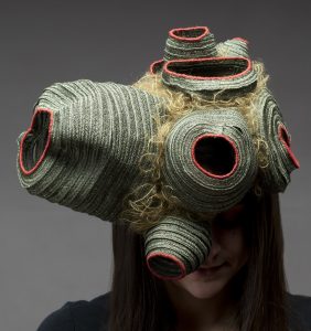 Monocle (2017), millinery straw, thread, wood, 9 by 12 by 11 inches