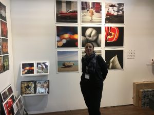 Photographer Camile O'Briant with her work